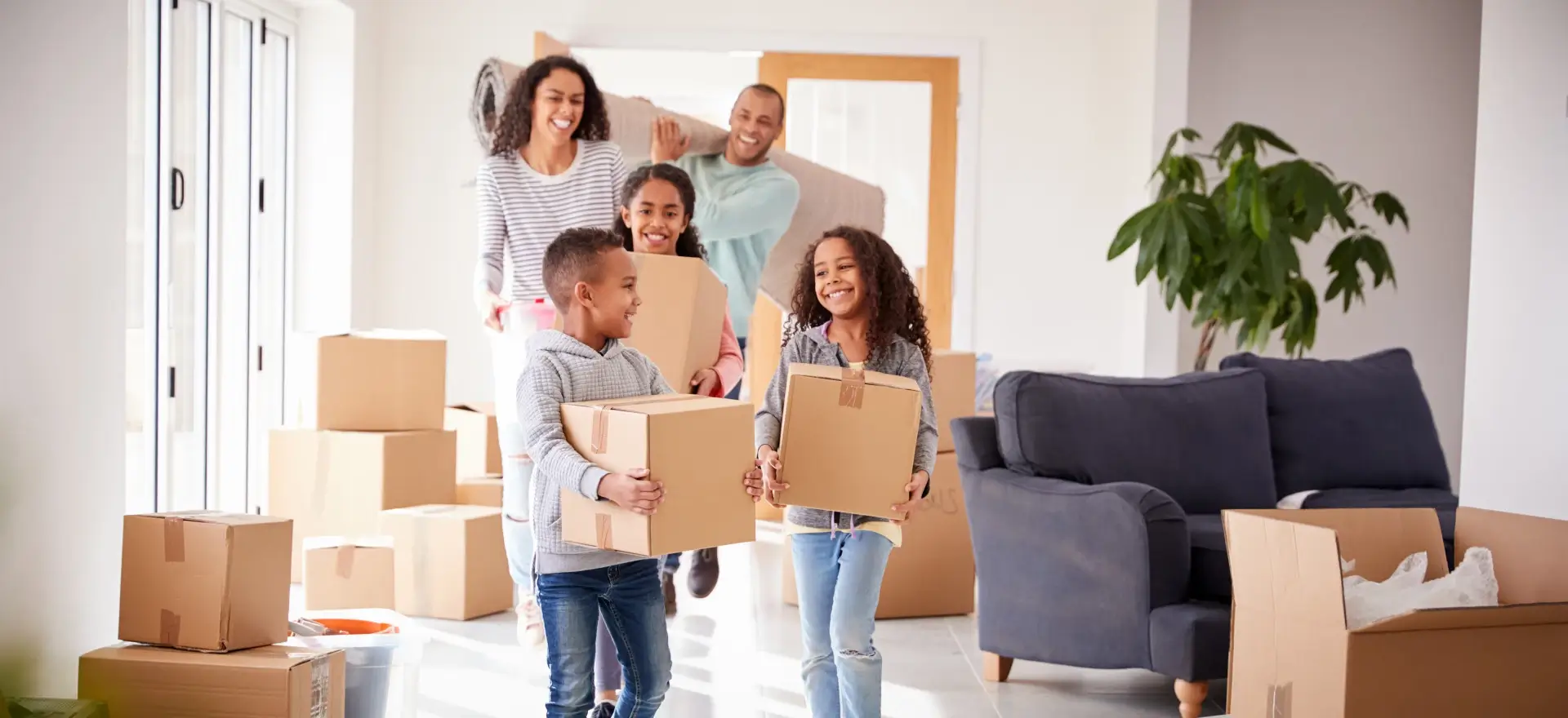 Happy family moving in to their new home thanks to Nationwide Fair Lending